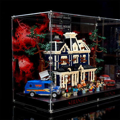 Angled view of the acrylic display case with transparent panels and the Creel House 11370 model shown for display reference