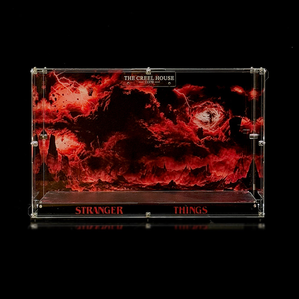 Empty acrylic display case with a red-and-black scenic background and dark display base for Creel House 11370