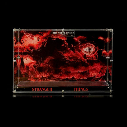 Empty acrylic display case with a red-and-black scenic background and dark display base for Creel House 11370