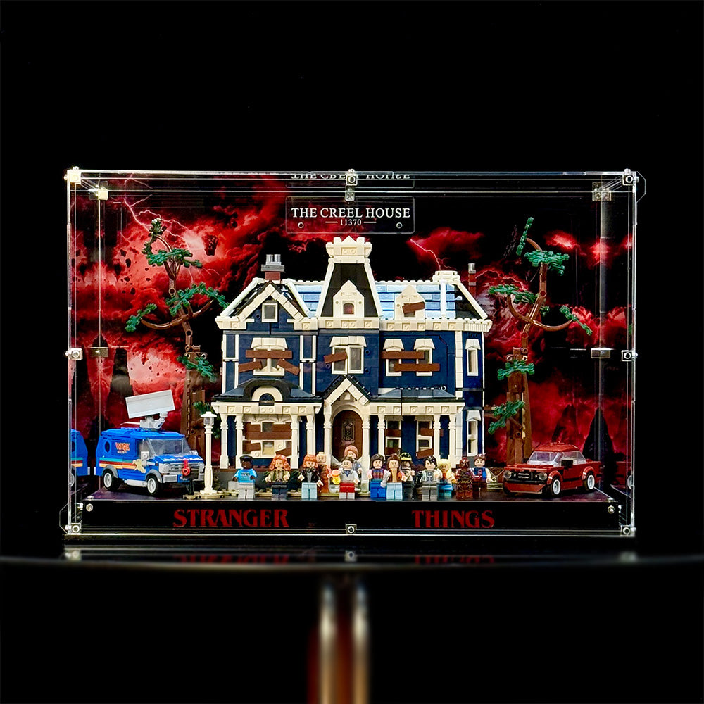 Front view of the acrylic display case with the LEGO 11370 Creel House model shown for display reference