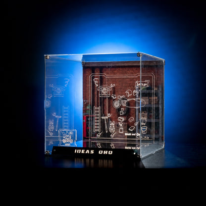 KGBOX collector LED display case side view for LEGO 21371 Wallace and Gromit, showing engraved line-art panel