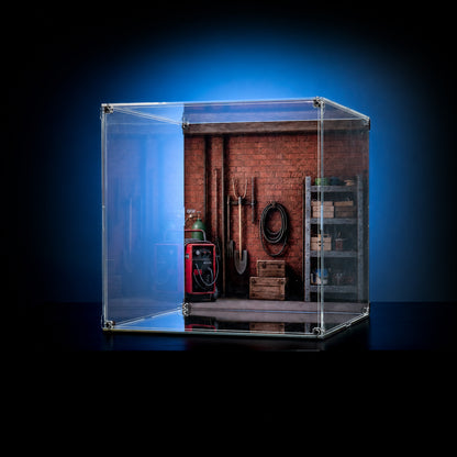 KGBOX standard acrylic display case for LEGO 21371 Wallace and Gromit, empty case showing UV-printed brick garage backdrop and mirror base