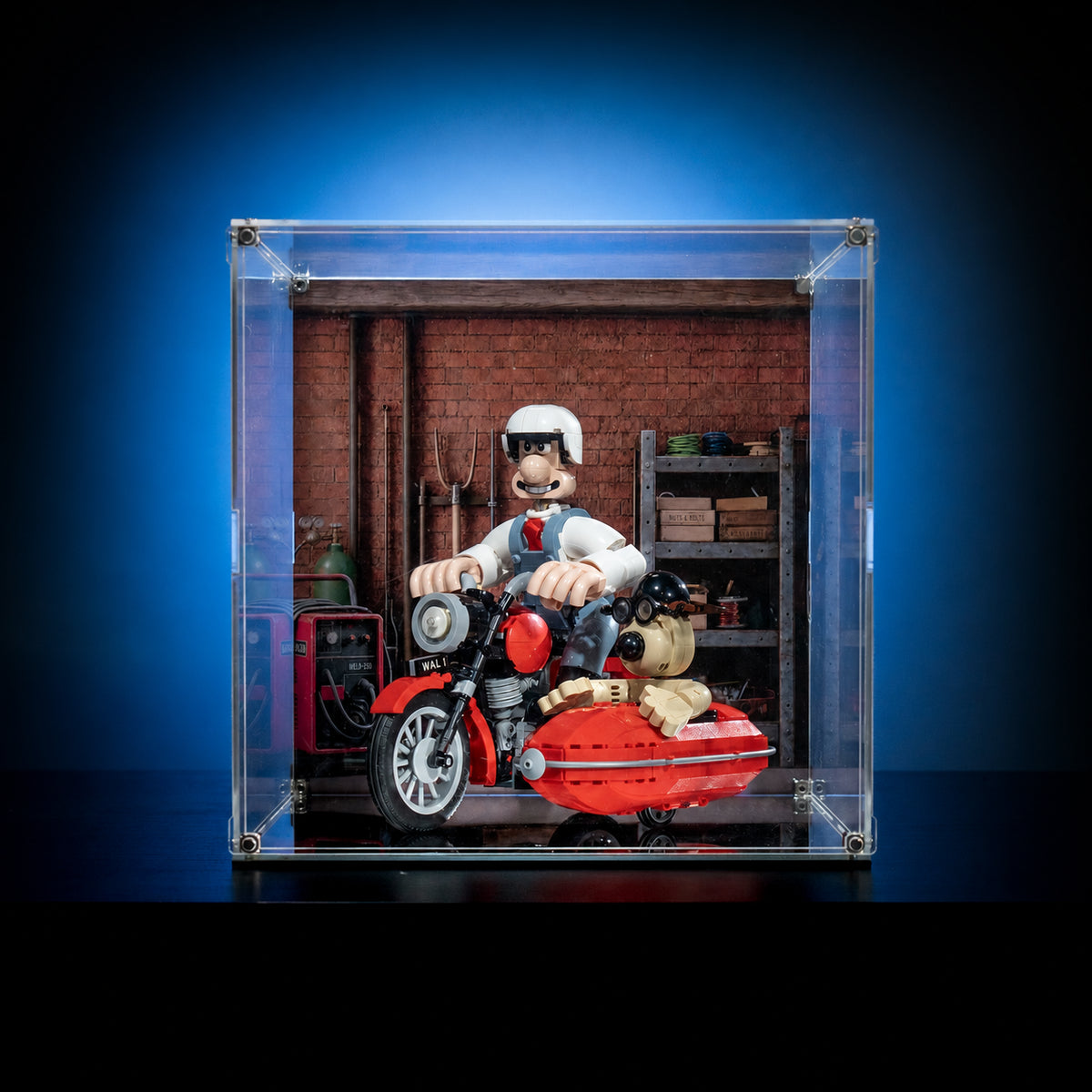 KGBOX standard acrylic display case with LEGO 21371 Wallace and Gromit motorbike, magnetic front door and UV-printed garage backdrop