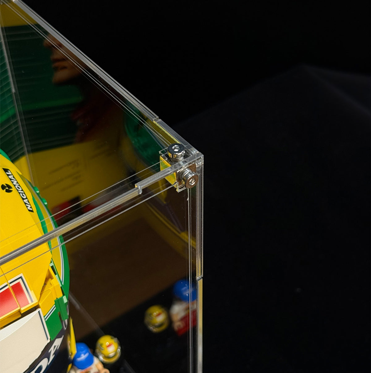 Transparent top and side panels with screw-fastened corner connections